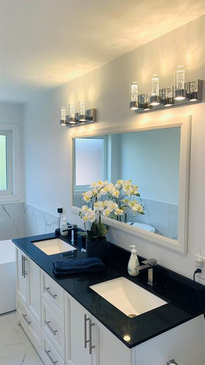 Double vanity with quartz top and vanity lighting